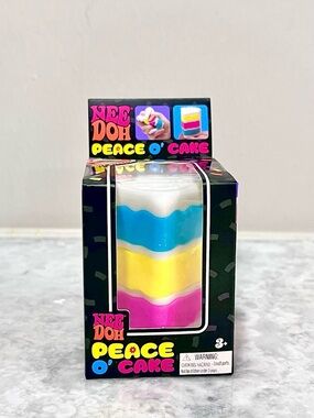 NeeDoh Peace O' Cake Squeeze Toy - White, Blue, Yellow & Pink